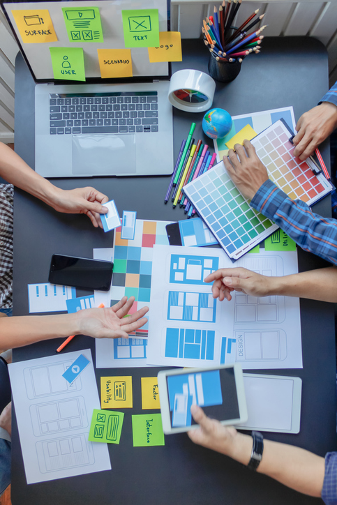 image of a design team using color cards to design a sensory room 